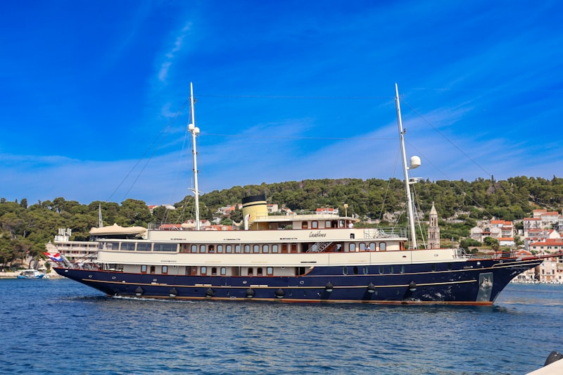 a large boat floating on top of a body of water